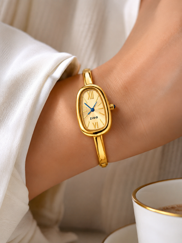 Velmira Oval Roman Dial Gold Ton Watch
